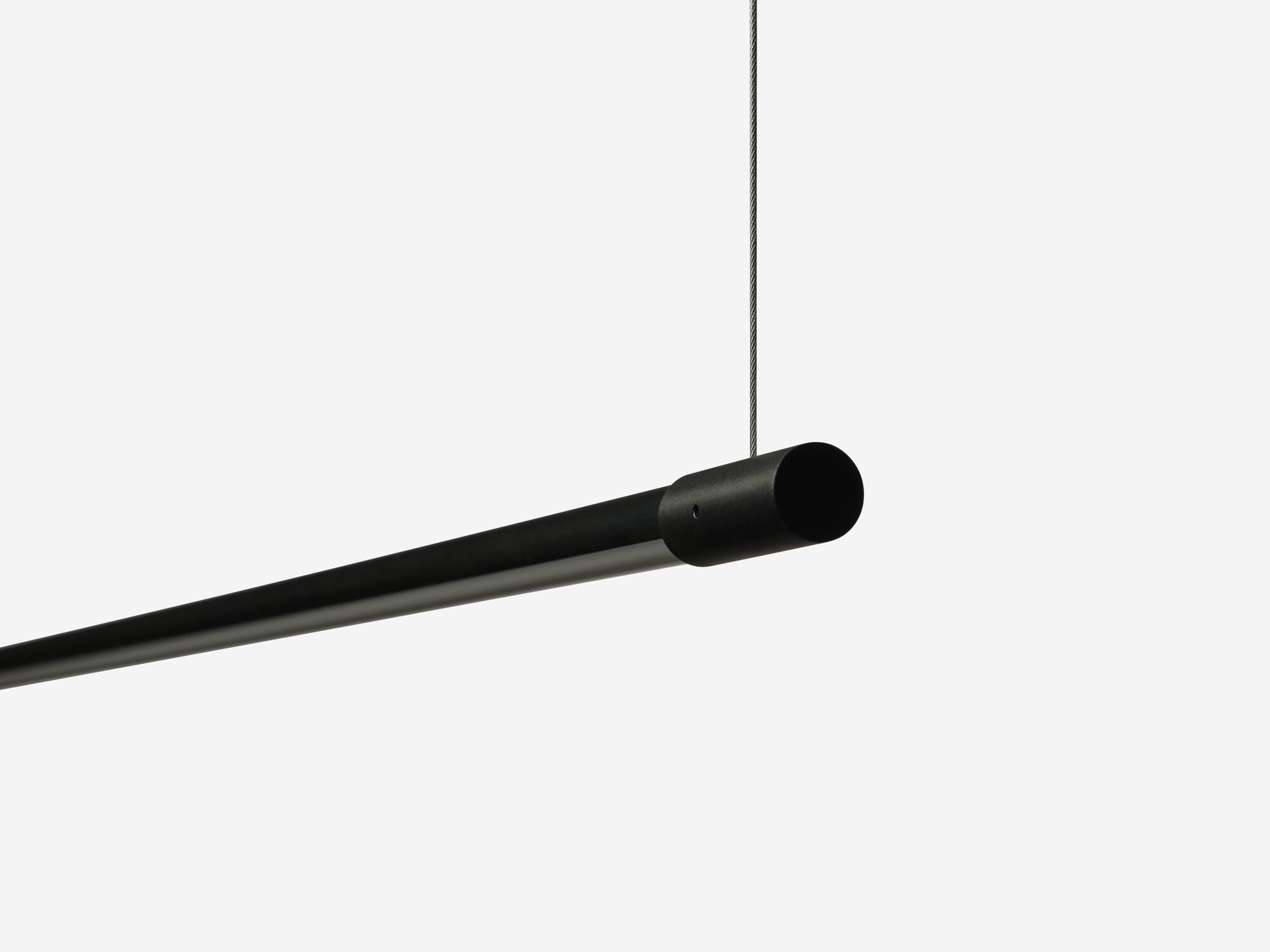 Detail view of slim black pendant lamp